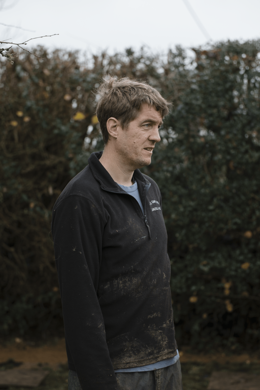 Skilled landscaper plans his next tasks in a high end garden scheme